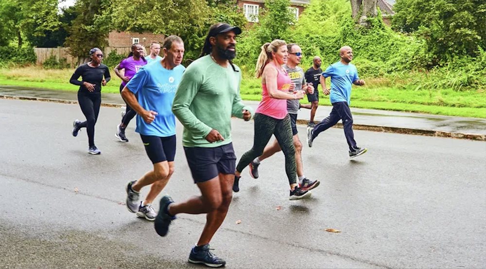 Group of people running outdoors